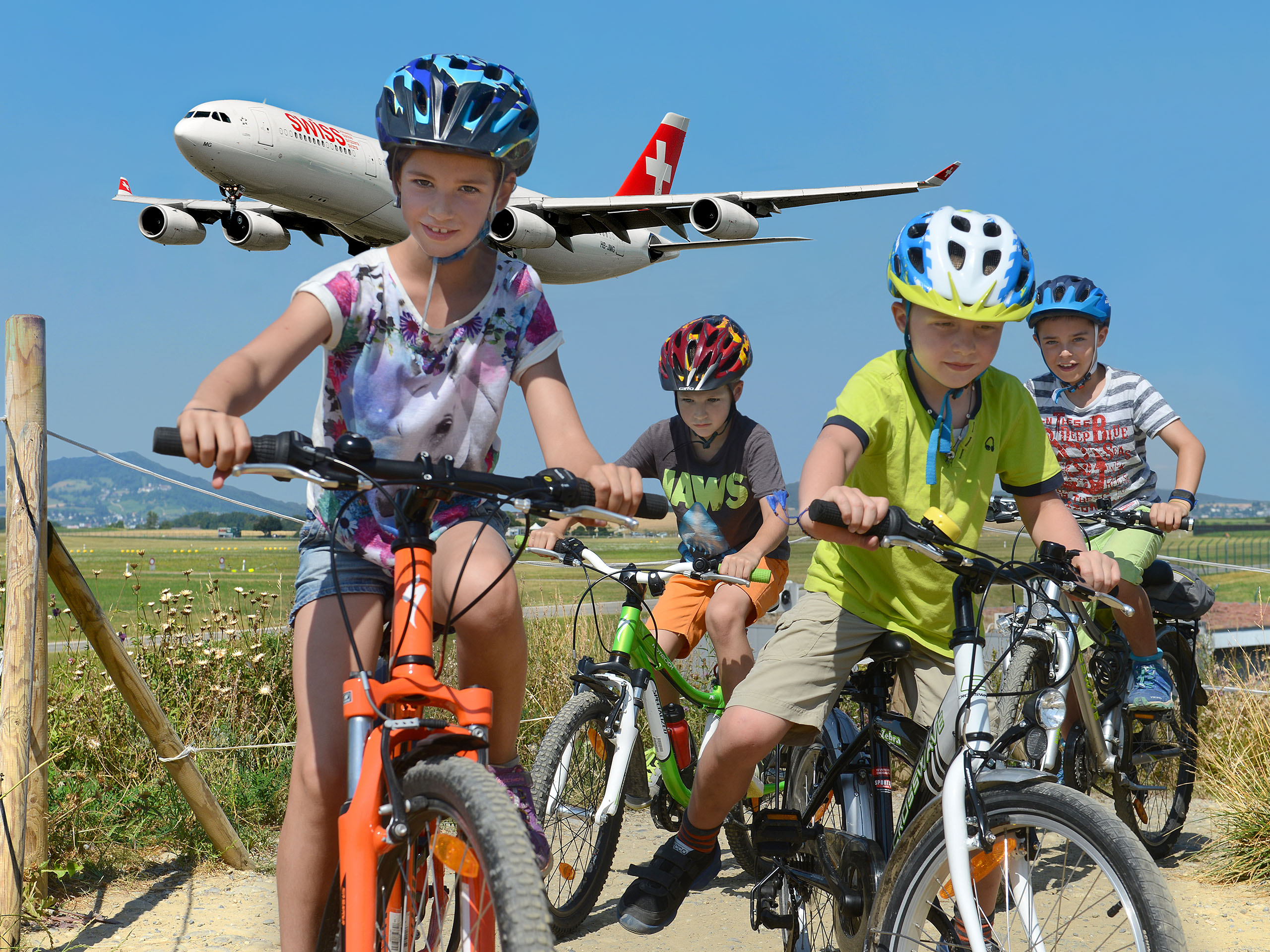 Children with the bicylce at the airport