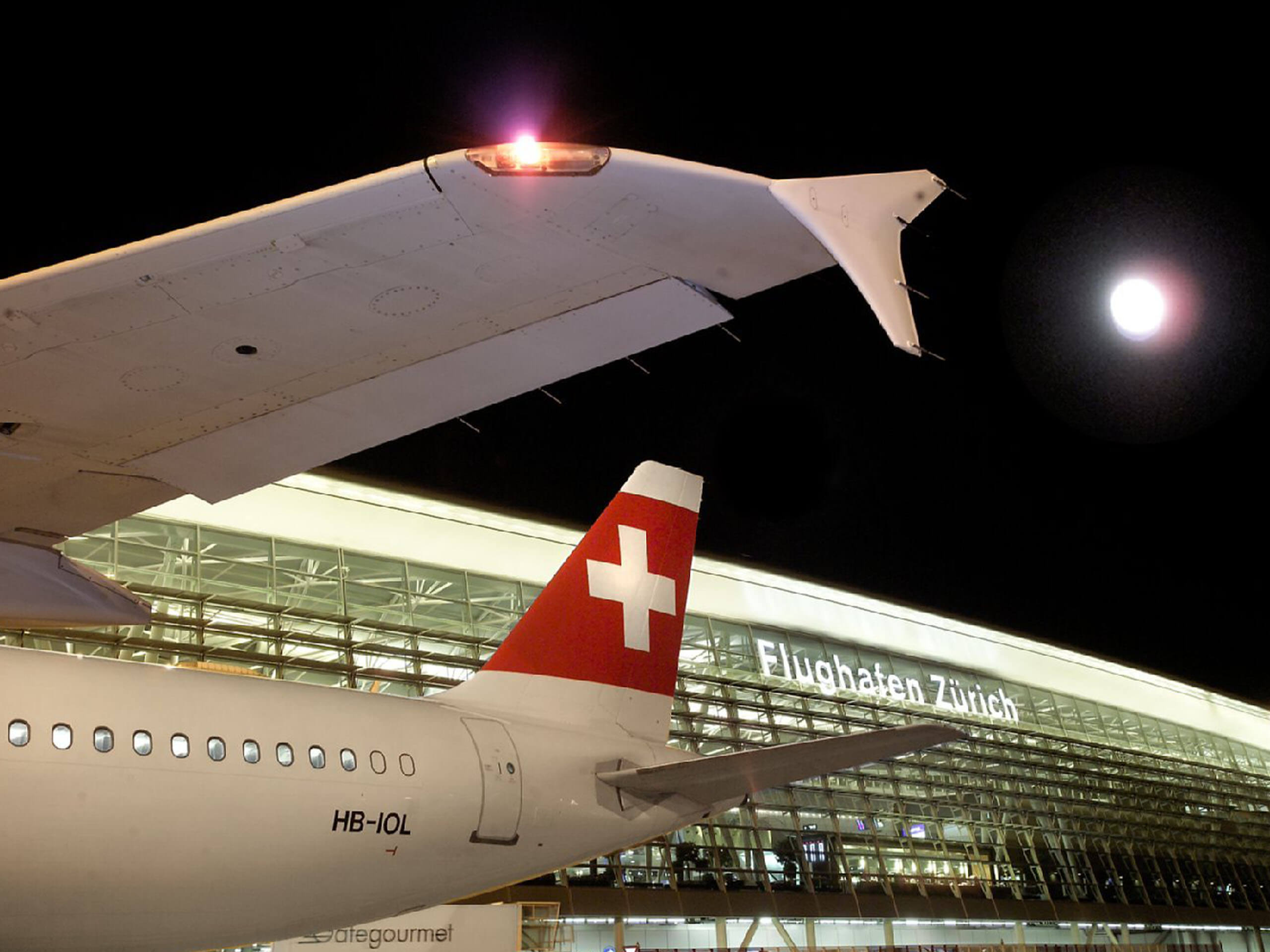 Swiss airplane by night